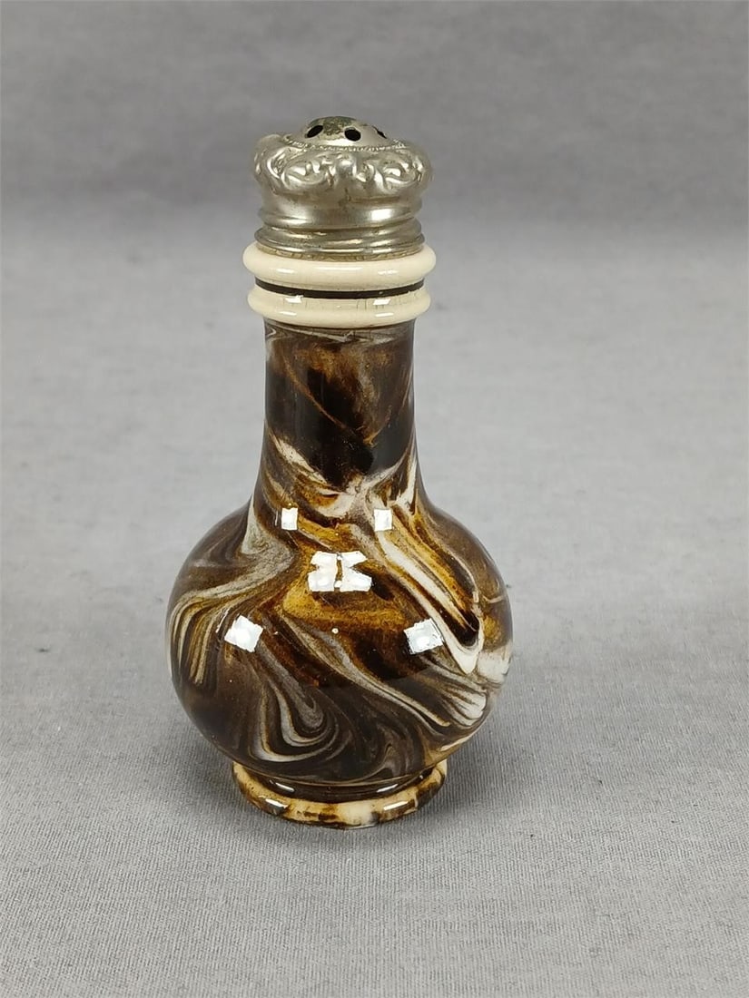 J Macintyre Marbled Mochaware Pepper Pot C1855-67: Antique British mid 19th century brown and cream marbled mochaware pepper pot. Silvertone metal cap. Has a partial impressed mark on the base. Produced by J. Macintyre between 1855 and 1867. Has crazi