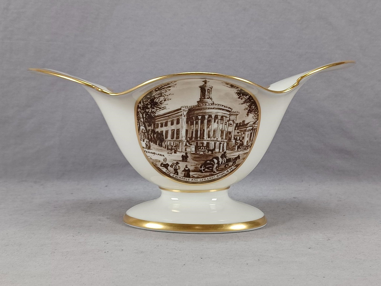 Lenox The Exchange Philadelphia Porcelain Bowl: Nice vintage porcelain bowl. Decorated with a scene titled The Exchange And Gerards Bank 1839 Philadelphia and Old Castle Garden 1853 New York on the other. Marked on the bottom Lenox Made in USA.Has 