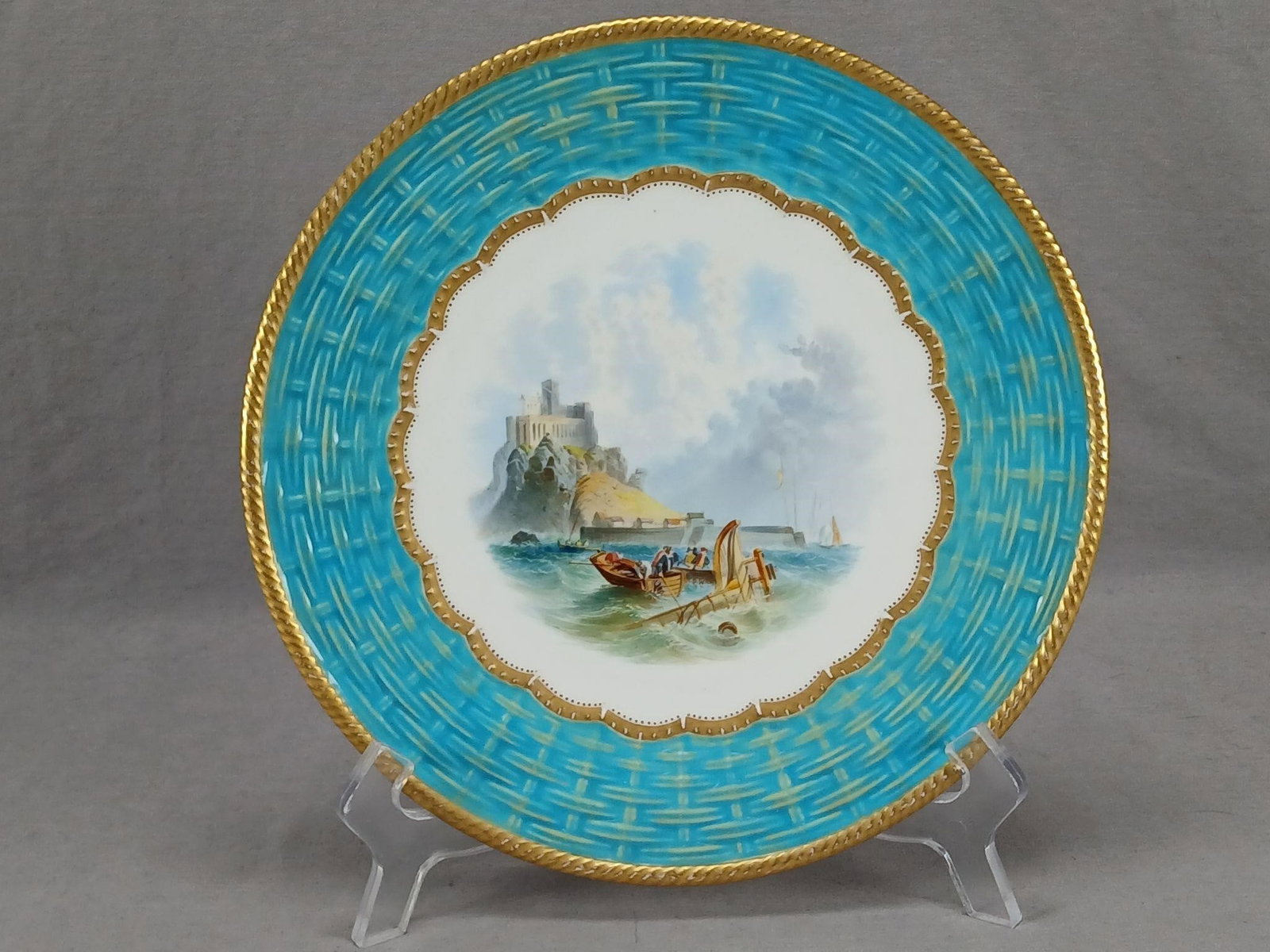 Thomas Ford Hand Painted Shipwreck Turquoise Plate: Nice antique British bone china plate with a relief molded basketweave border in turquoise enamel. Gold gilding along the edge and inner rim. Decorated with a hand painted maritime scene depicting men