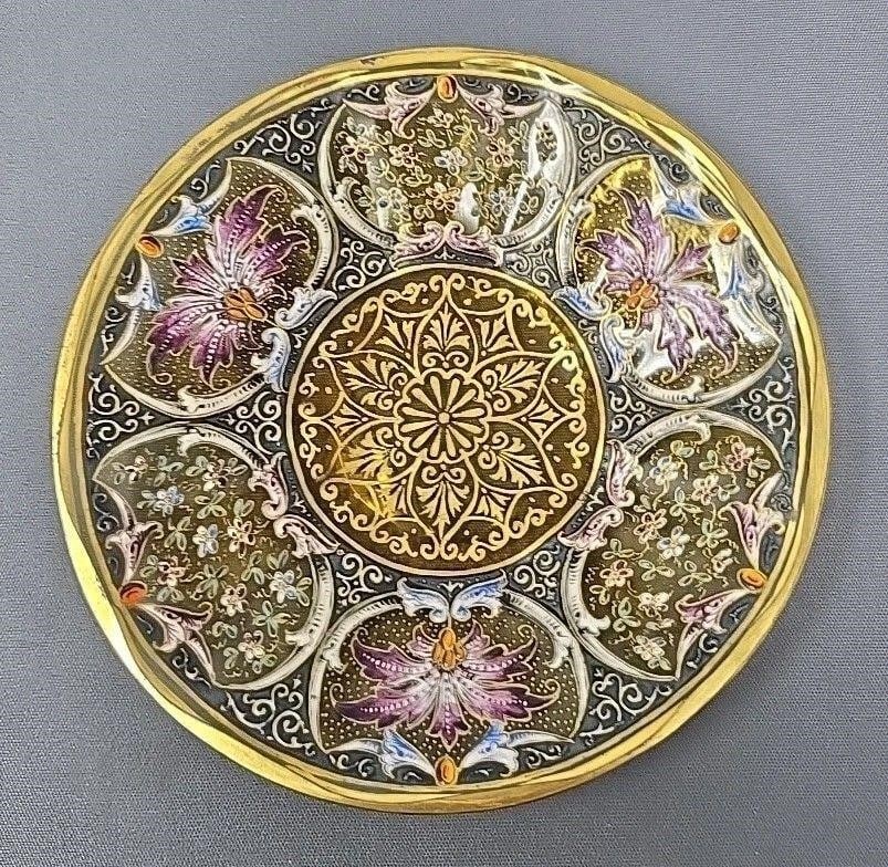 Moser Style Hand Enameled Saucer Undertray: Hand decorated enameled Bohemian Moser style saucer or under plate. Purple flowers with a gold medallion in the center. Optic molded on amber / citrine glass. Measures approximately 5 1/8 inches long,