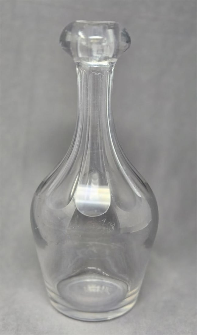 Pittsburg cut glass back bar bottle: Pittsburg cut glass back bar bottle. Slice Cut fluting on top with a blob top. Circa 1850s. Measures 10 inches tall and 4 1/4 inches wide in middle. Scratches from use but no chips or cracks. This wou