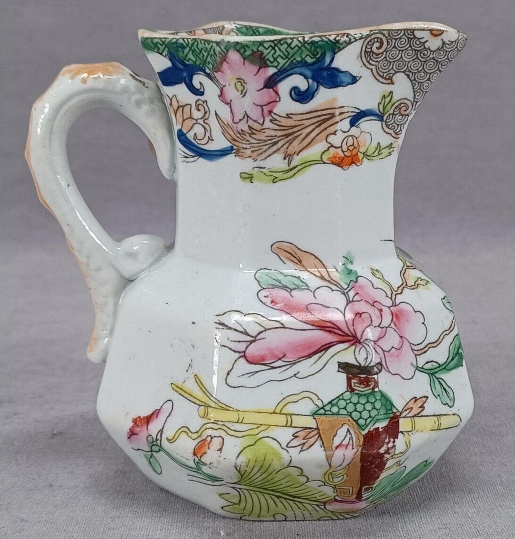 Masons Table and Flower Pot 3 5/8" Jug C 1813-1826: Nice antique Mason's ironstone miniature hydra jug in the Table and Flower pattern. Impressed in a circle Patent Ironstone China. Circa 1813 to 1826.Has wear consistent with age and use and a small in