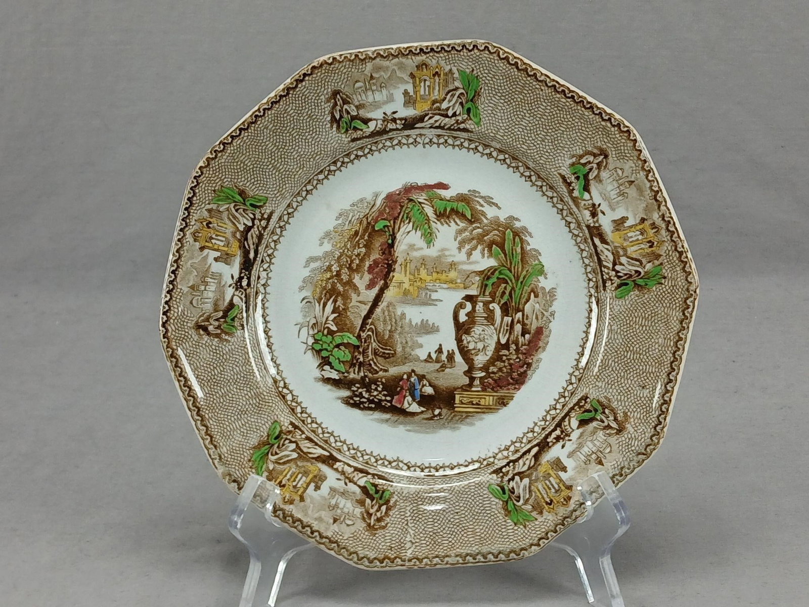 Harvey Ailanthus Transferware 8" Plate C.1832-53: Antique British earthenware plate. Decorated in the Ailanthus pattern in brown transfer. With hand colored highlights in yellow, green, pink, and blue. Has an impressed mark with Harvey at the bottom.