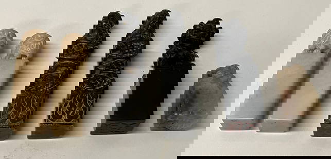 Six Chinese Stone Seals: An assortment of six archaic Chinese stone seals. Three are black stone with two of them as a pair, identification is uncarved, one single black seal of a foo lion, two are a pair of white stone ident