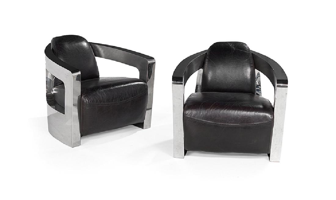 Pair of Contemporary Leather and Steel Armchairs: Pair of Contemporary Art Deco-Inspired Leather and Polished Steel Armchairs, in the "Sinclair Club Chair" design, probably manufactured by "Four Hands", each with split wraparound arms and black leath