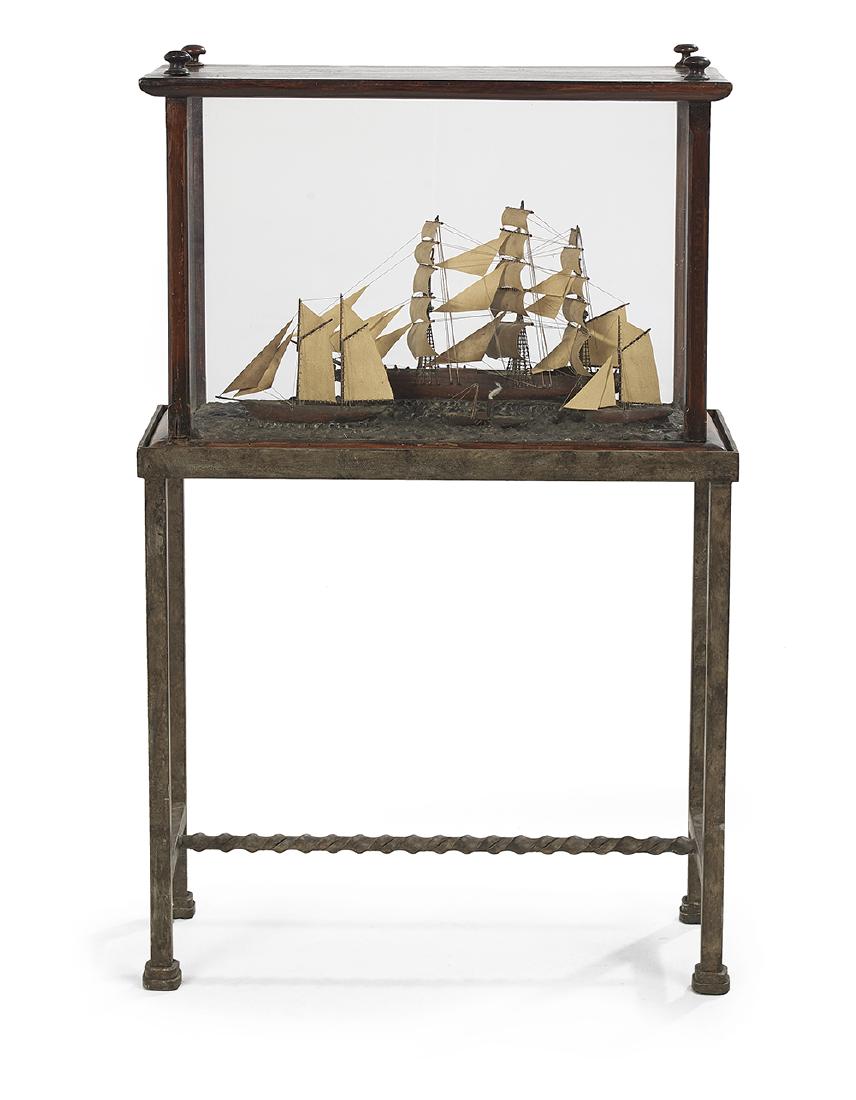 Four Victorian Cased Ship Models: Four Victorian Cased Ship Modelsfourth quarter 19th century, in a hardwood case, English, all on carved "waves", the wood, cloth and metal models including a clipper ship to the rear, a schooner in th