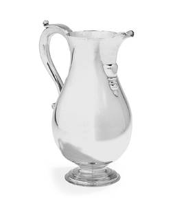 Mario Buccellati Sterling Silver Pitcher: Mario Buccellati Sterling Silver Pitcher third quarter 20th century, Milan, the pear-shaped body with "duck's beak" spout, crested "S-scroll" handle and domed foot. h. 9-1/8", l. 7-1/2", dia. 5"; 26.8