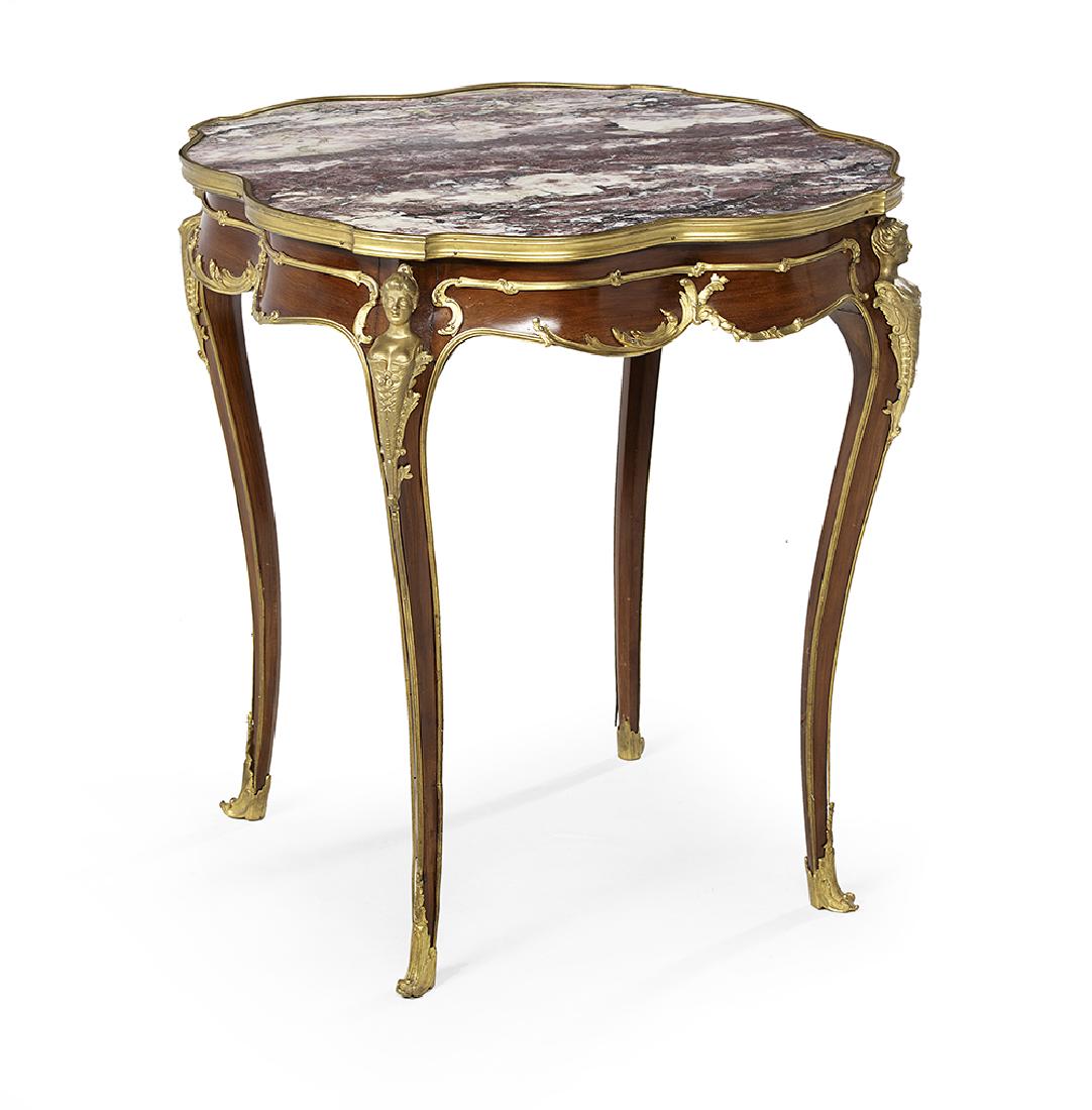 Mahogany and Marble-Top Occasional Table: Mahogany and Marble-Top Occasional Table early 20th century, in the manner of Joseph-Emmanuel Zwiener (1848-1925), the floriform marble top with brass banding and above a conforming ogee-molded frieze