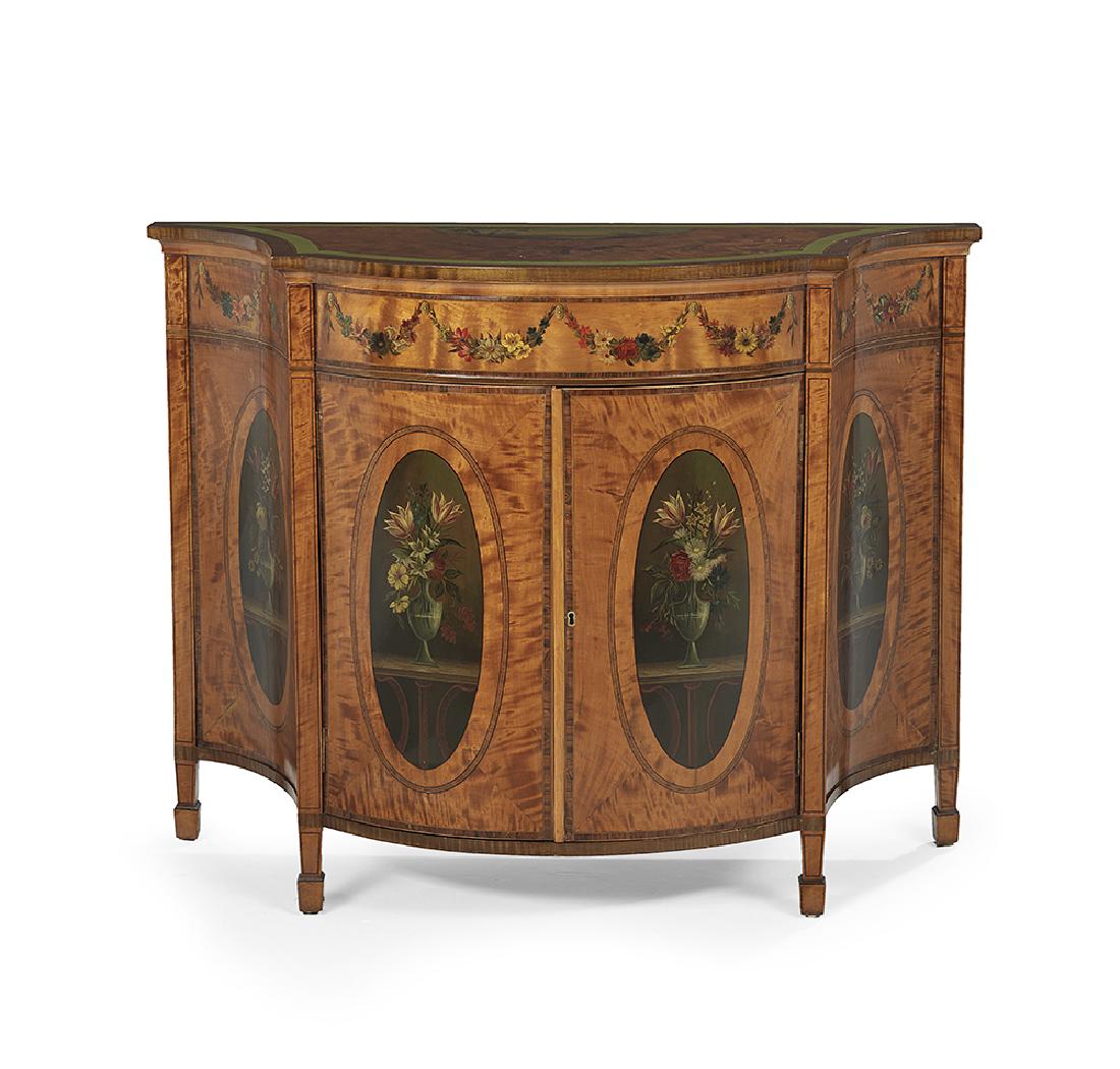 Edwardian Satinwood Cabinet: Edwardian Satinwood Cabinet early 20th century, the bowed and shaped top banded and centered by a polychrome landscape and floral basket, above a conforming case fitted with a floral garland-decorated