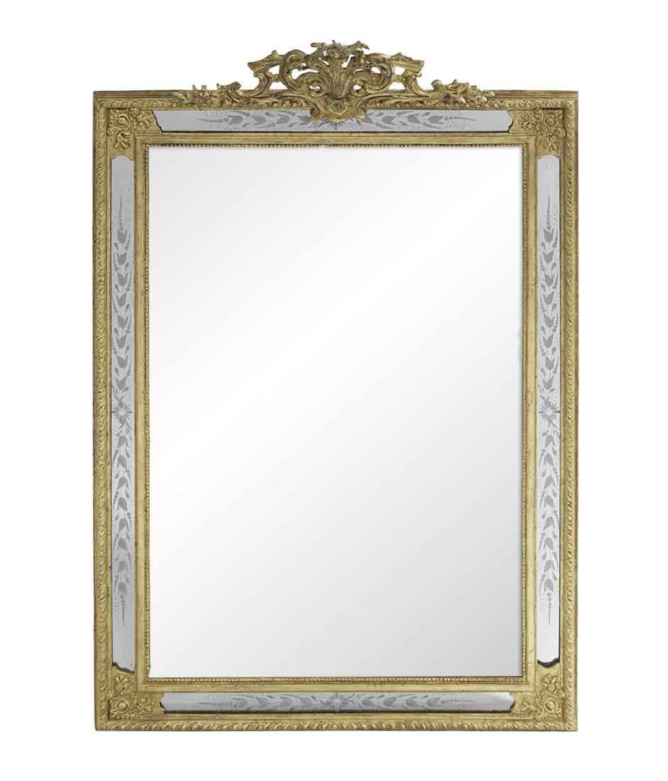 Engraved Giltwood Mirror of Rococo Inspiration: Engraved Giltwood Mirror of Rococo Inspiration mid-19th century, French, with a gadrooned surround, the mirror-inset side panels engraved with leaves and set with molded giltwood, the pierced crest wi