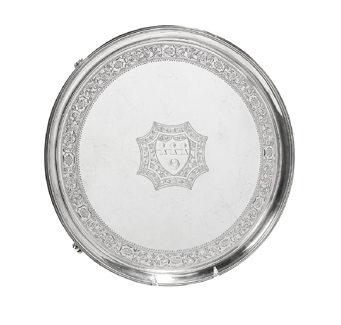 George III Sterling Silver Salver: George III Sterling Silver Salver hallmarked London, 1789-1790, by Robert Sharp (ca. 1733-1803; free 1757), of circular form with reeded rim and raised on four bracket feet, engraved with a band of al