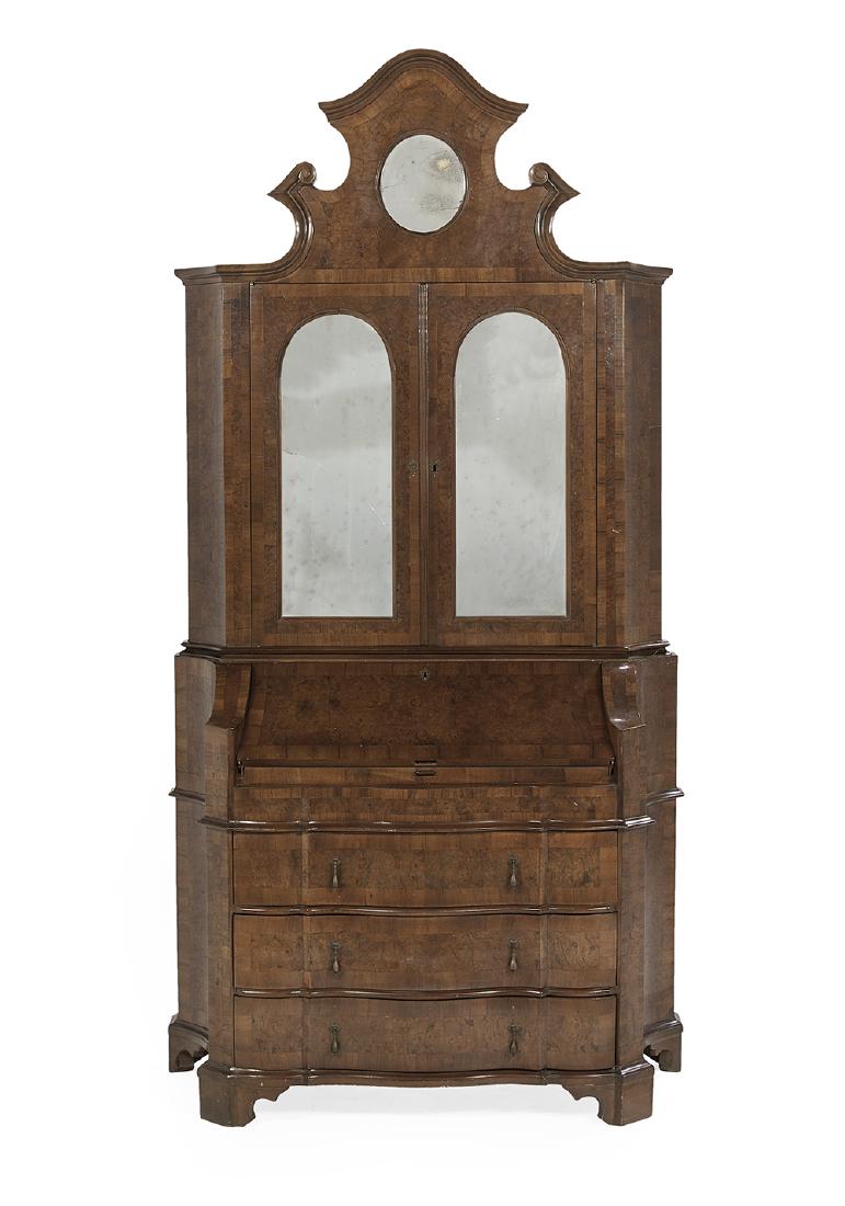 Northern Italian Walnut and Burl Secretary: Northern Italian Walnut and Burl Secretary early 19th century, the molded, domed and broken cornice above a tall frieze with an inset circular mirrored panel, over two doors, each inset with a domed m