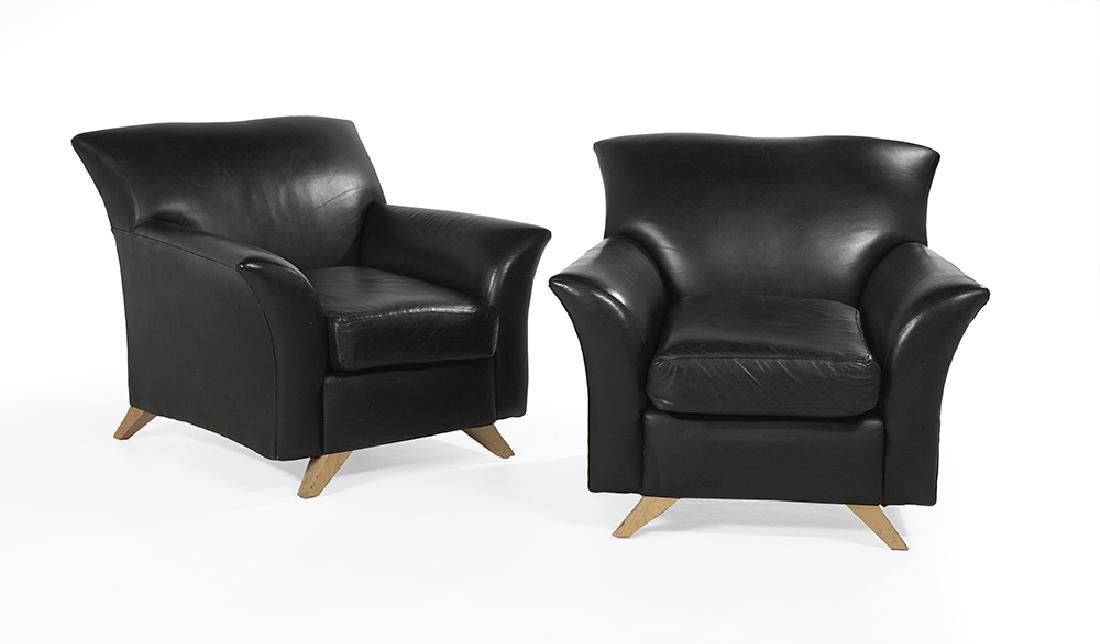 Pair of Art Deco-Inspired Leather Lounge Chairs: Pair of Art Deco-Inspired Black Leather Lounge Chairs second half 20th century, with flared backs and out-curved arms, raised on rock maple splayed legs. h. 34"
