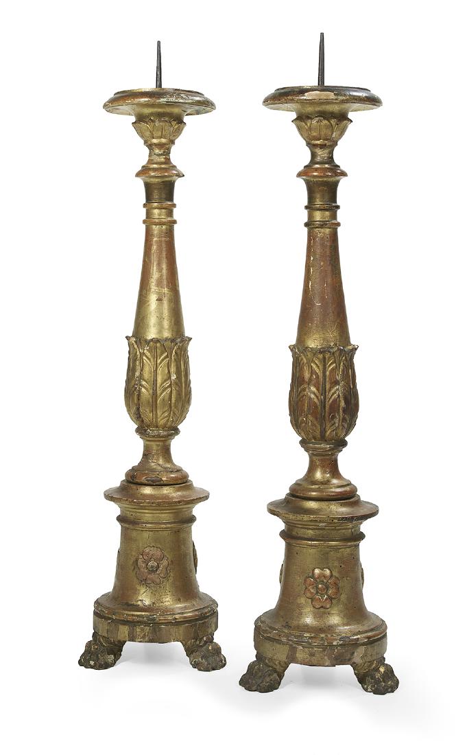 Pair of Italian Neoclassical Giltwood Altar Sticks: Pair of Italian Neoclassical Giltwood Altar Sticks second quarter 19th century, supported by paw feet, the bases decorated with flowerheads and mounted with tapering leaf-carved standards terminating 