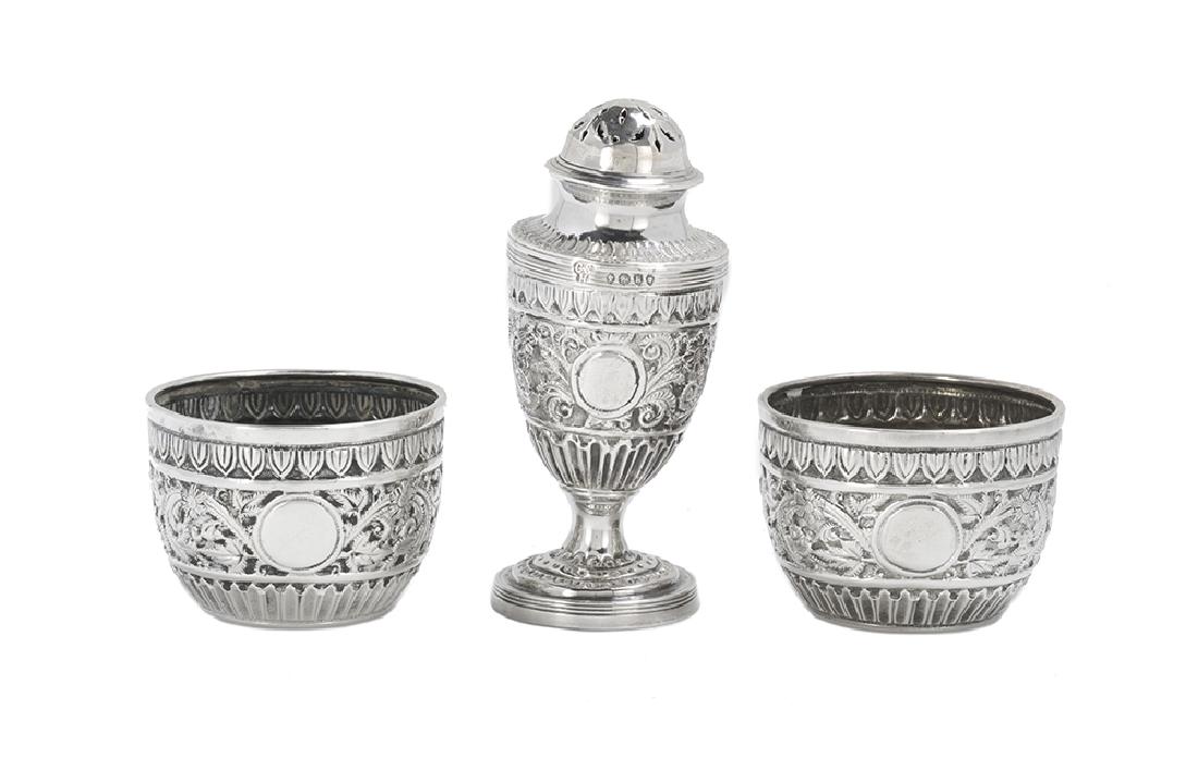 Victorian Cased Sterling Silver Salt and Pepper Set: Victorian Cased Sterling Silver Salt and Pepper Set hallmarked London, 1885-1887, by Charles Stuart Harris (fl. 1852-1897), in the Raj taste, including a pair of bowl-form salt cellars and a single fo