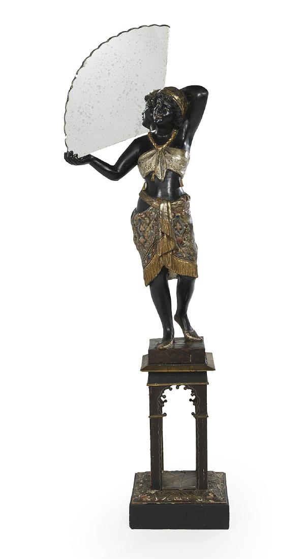 Venetian Carved Blackamoor with a Mirrored Fan: Unusual Venetian Carved Blackamoor with a Mirrored Fan first quarter 20th century, on a pierced, gilt-trimmed pedestal, the female figure dressed in a polychrome and gilt-painted shawl trimmed with fr