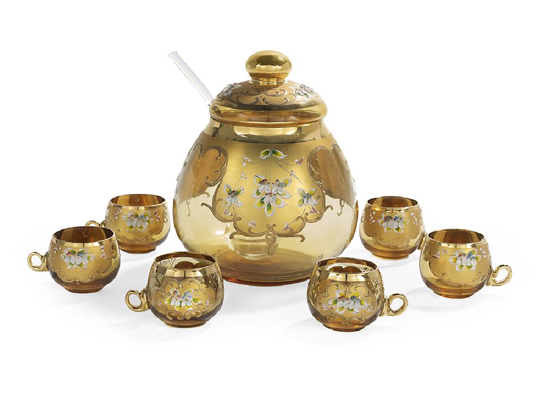 Enameled Glass Covered Punch Bowl and Cups: Enameled Glass Covered Punch Bowl and Cups second quarter 20th century, Czech, attributed to Moser, composed of shaded amber glass decorated with gilt panels, with raised edges and enamel flowers, the