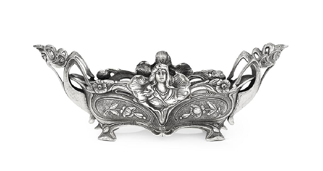 German Art Nouveau Silverplate Jardiniere: German Art Nouveau Silverplate Jardiniere first quarter 20th century, navette-shaped, cast with elaborate "whiplash" rim and handles, female busts, and scrolling flowers, fitted with a conforming line
