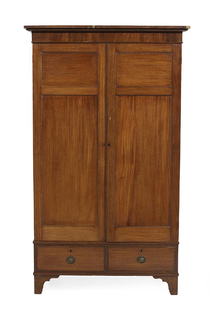 Edwardian Mahogany Armoire: Edwardian Mahogany Armoire ca. 1900, with an overhanging cornice molding above two paneled doors and a pair of drawers in the base. h. 78", w. 47", d. 23"