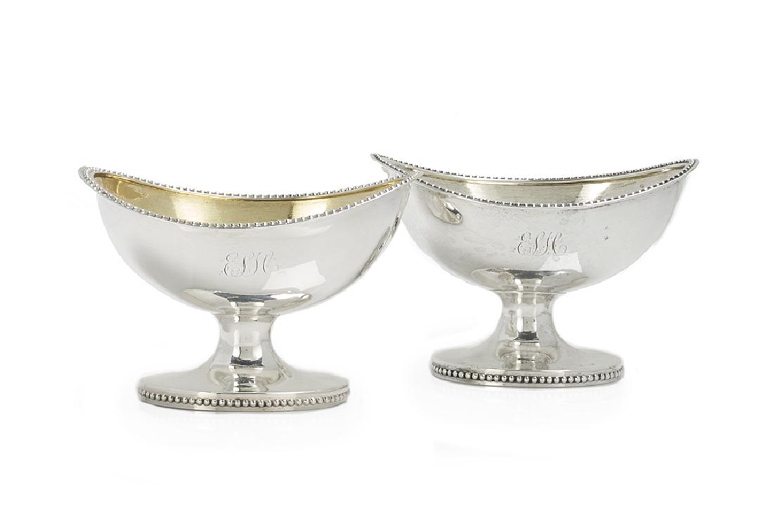 Near Pair of American Coin Silver Salt Cellars: Near Pair of American Coin Silver Salt Cellars third quarter 19th century, by George Sharp (1819-1904) for Bailey & Co., Philadelphia, Pennsylvania, pedestal form, oval with upswept ends and raised on