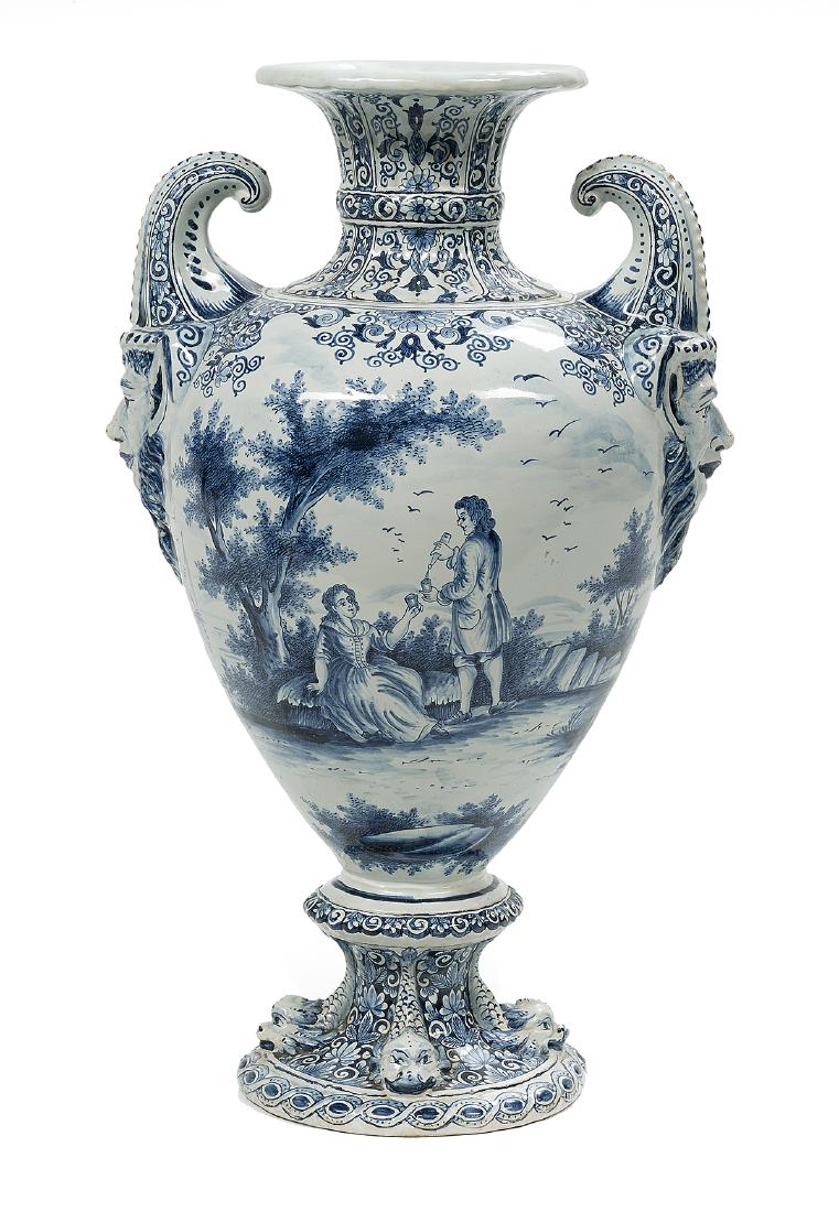 Impressive Dutch Tin-Glazed Delft Urn: Impressive Dutch Tin-Glazed Delft Urn fourth quarter 19th century, decorated with scenes of windmills and boats, the base with dolphins, the handles with molded satyr heads, with a spurious "AR" mark 