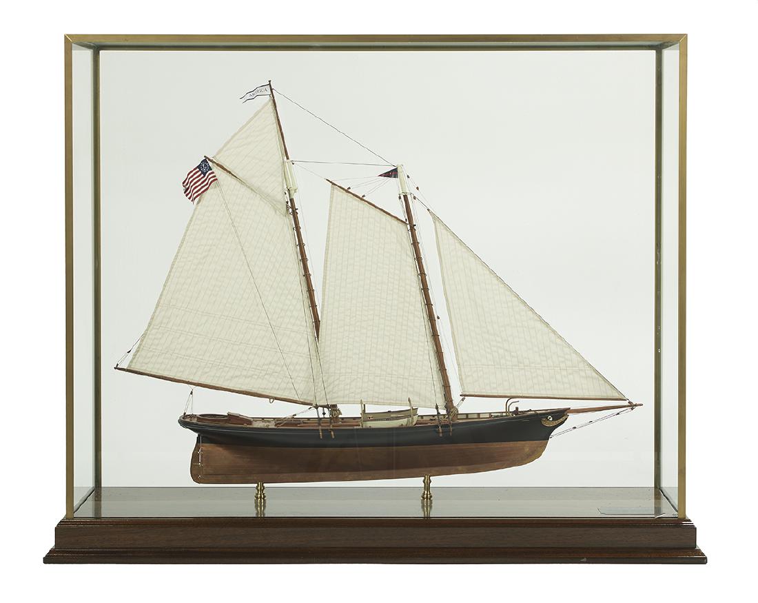 Model of the Racing Yacht "America": American Wood, Metal and Fabric Model of the Racing Yacht America 20th century, the carefully detailed model with a painted hull, mahogany deck, sails and rigging, it won the renamed First America's C
