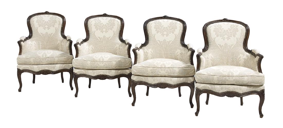 Suite of Four Louis XV-Style Beechwood Bergeres: Suite of Four Louis XV-Style Beechwood Bergeres each with a floral-carved and molded crest, closed arms, serpentine seat, cabriole legs and fitted with a loose seat cushion. h. 37"
