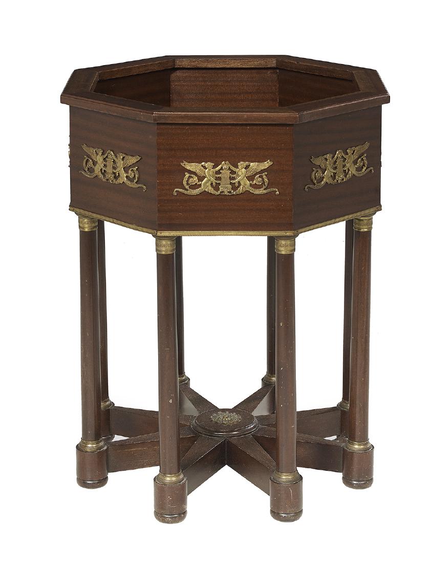 Empire-Style Mahogany Planter: Empire-Style Mahogany Planter 20th century, the open octagonal top above a conforming case with ormolu mounts, raised on eight columnar supports headed by ormolu capitals and joined by a spoke-form st