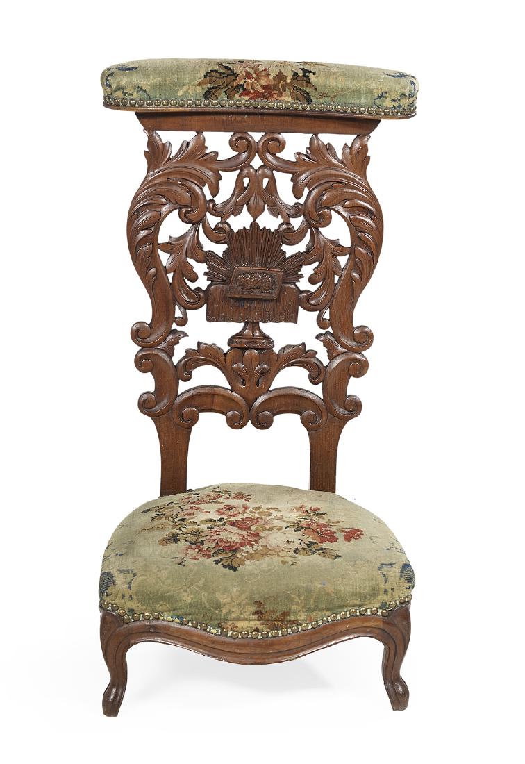 Napoleon III Mahogany Prie-Dieu: Napoleon III Mahogany Prie-Dieu third quarter 19th century, in the rococo taste, the padded arm rest over a pierced foliate-carved back, centered by a carved lamb, the cushion over a serpentine front 