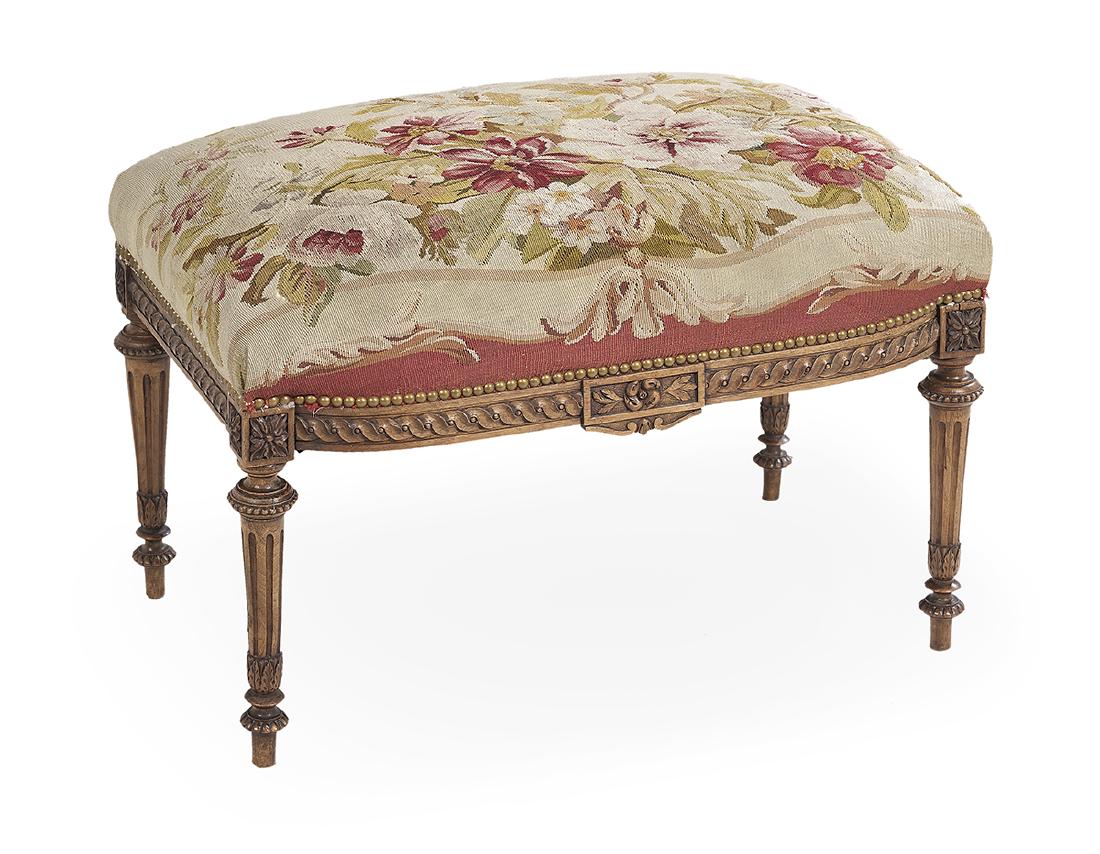 Louis XVI-Style Fruitwood Stool: Louis XVI-Style Fruitwood Stool 20th century, the padded rectangular top upholstered in a floral Aubusson fabric, above a guilloche-carved frieze, raised on fluted tapering circular legs ending in tou
