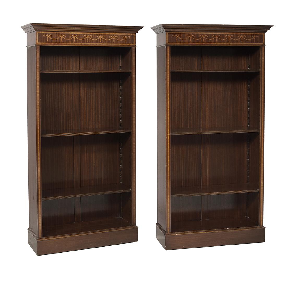 Pair of Georgian-Inspired Open Shelf Bookcases: Pair of Georgian-Inspired Mahogany-Inlaid and Banded Open Shelf Bookcases each with a projecting cornice over a crossbanded frieze with inlaid ribbon, swags and bellflowers, the adjustable shelves fla