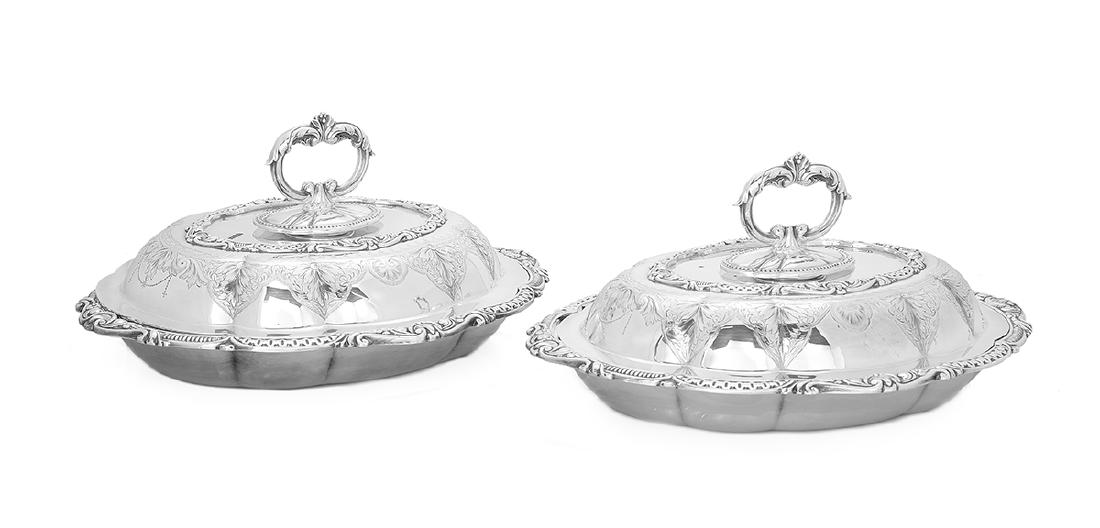 Pair of Victorian Silverplate Entree Dishes: Pair of Victorian Silverplate Entree Dishes fourth quarter 19th century, by John Round & Son, of lobed oval form with applied rocaille rim and engraved leaf and shell arabesque decoration, the fitted 