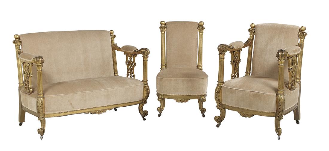 Three-Piece Giltwood Parlor Suite: Neoclassically Inspired Three-Piece Giltwood Parlor Suite early 20th century, composed of a sofa, an arm chair and a side chair, with fluted stiles capped with Corinthian capitals, the arm supports of