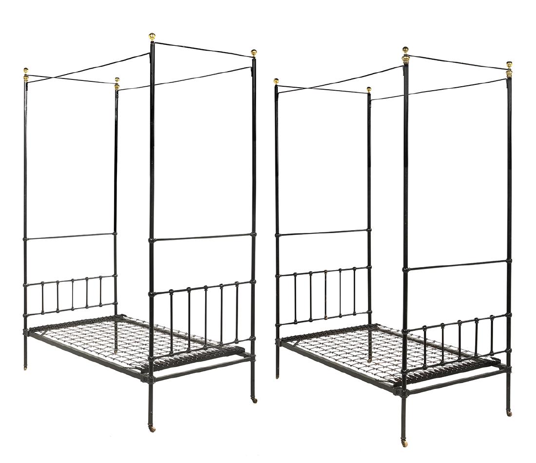 Pair of Brass-Mounted Iron Four-Post Twin Beds: Pair of Ebonized and Brass-Mounted Iron Four-Post Twin Beds early 20th century, each with tubular posts ending in brass ball finials and fitted with iron rails and a spring-mounted frame. h. 116", out