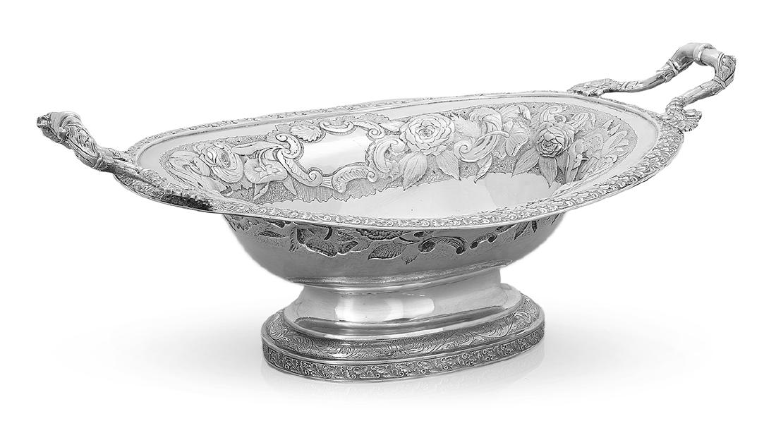 Large New York Coin Silver Fruit Bowl: Large New York Coin Silver Fruit Bowl mid-19th century, by William Adams (1802-1861), New York City, oval with richly decorated repousse floral band, engraved foliate bottom, with palmette-mounted sti