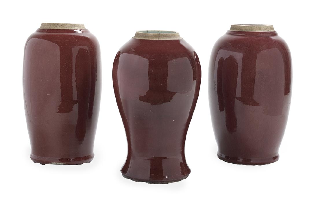 Three Chinese Sang-de-Boeuf Porcelain Vases: Group of Three Chinese Sang-de-Boeuf Porcelain Vases first half 20th century, one of baluster form with shallow neck and splayed foot, and two of ovoid form, each with an even deep scarlet "sang-de-bo