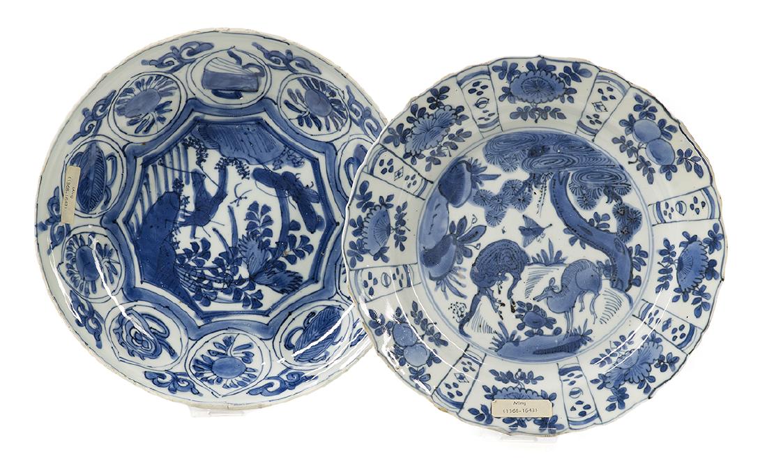 Two Chinese Blue and White Porcelain Dishes: Two Chinese Blue and White Porcelain Dishes probably Ming Dynasty, 17th century, the larger example with flared cavetto and everted lip, decorated with a central garden scene surrounded by individual 