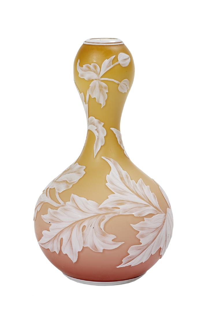 Thomas Webb & Sons Cameo Peach Bloom Vase: Thomas Webb & Sons Cameo Double Gourd Peach Bloom Vase fourth quarter 19th century, the sides decorated with carved leaves, blossoms and a butterfly, signed "Thomas Webb & Sons" on the base. h. 7", di