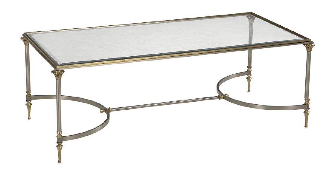 Contemporary Steel and Brass Cocktail Table: Contemporary Brushed Steel and Brass Cocktail Table in the manner of Maison Jansen, of neoclassical inspiration, with a rectilinear beveled glass top supported by columns with beaded capitals, joined