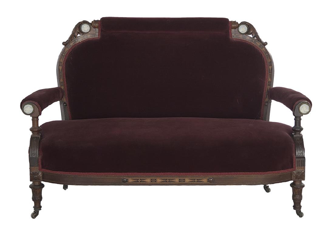 American Porcelain-Mounted Rosewood Settee: American Porcelain-Mounted and Marquetry-Inlaid Rosewood Settee third quarter 19th century, New York, the top rail with an upholstered roll flanked by pale blue and white bisque plaques and foliate ca