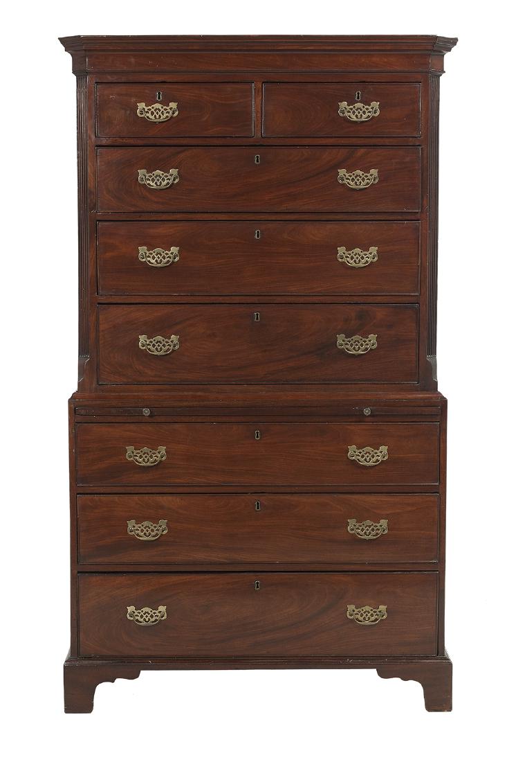 George III Mahogany Chest-on-Chest: George III Mahogany Chest-on-Chest fourth quarter 18th century, the molded and canted cornice above a conforming case fitted with two short drawers over three graduated long drawers, the lower section
