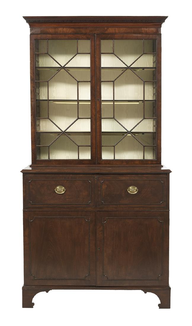 George III Mahogany Secretary: George III Mahogany Secretary early 19th century, the molded and dentillated cornice above two astragal-glazed doors, the lower section fitted with a drop front opening to a variety of drawers and cub