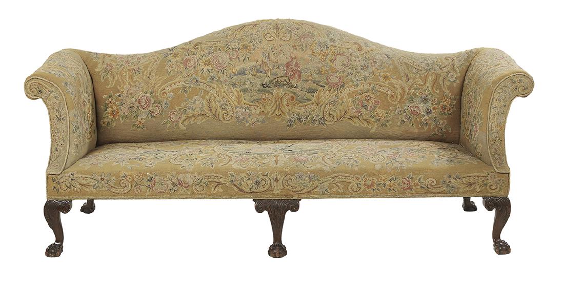 Chippendale-Style Mahogany Camelback Sofa: Chippendale-Style Mahogany Camelback Sofa ca. 1900, with an arched back, scrolled arms and raised on carved legs ending in ball-and-claw feet, covered in 19th-century petit point. h. 40", w. 96", d. 3