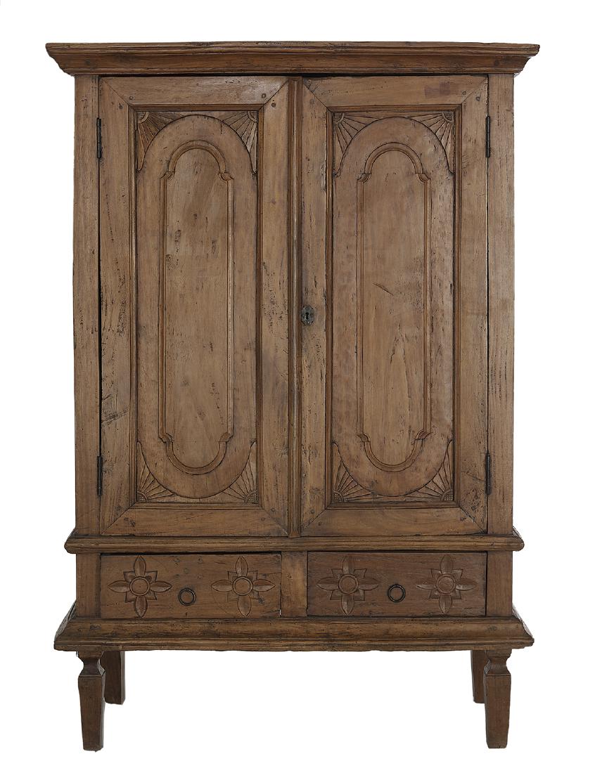 Continental Provincial Fruitwood Cabinet: Continental Provincial Fruitwood Cabinet early 19th century, the molded cornice above a case fitted with two doors, each inset with a panel with corner fan accents, above two small drawers, each with 