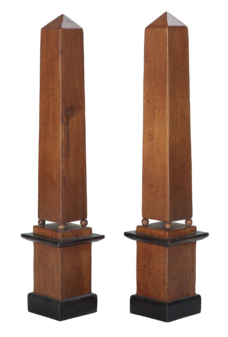 Pair of Neoclassical-Style Mahogany Obelisks: Pair of Neoclassical-Style Mahogany Obelisks 20th century, Continental, the obelisks resting on balls, above bases with ebonized trim. h. 20-1/4", w. 4"