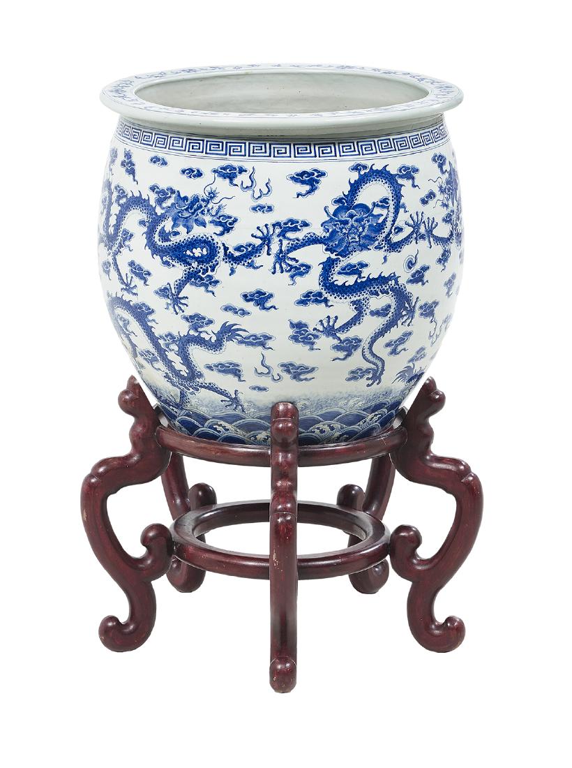 Chinese Blue and White Porcelain Planter on Stand: Large Chinese Blue and White Porcelain Planter on Stand second half 20th century, of ovoid form with flattened rim, decorated to the exterior with five-claw dragons chasing the flaming pearl above sty