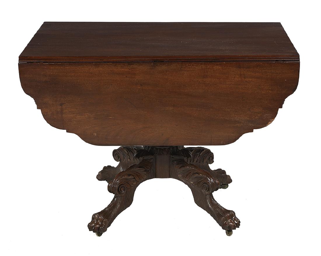 American Classical Mahogany Drop-Leaf Table: American Classical Mahogany Drop-Leaf Table ca. 1825, New York, the single-board top flanked by shaped drop leaves, over a frieze fitted with a single drawer, raised on a foliate-carved vasiform pedes