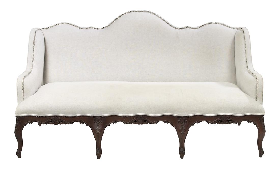 Provincial Louis XV-Style Mahogany Sofa: Provincial Louis XV-Style Mahogany Sofa by Henredon of generous proportions, with a scalloped and arched back, downswept arms and raised on carved legs. h. 44", w. 77", d. 35"
