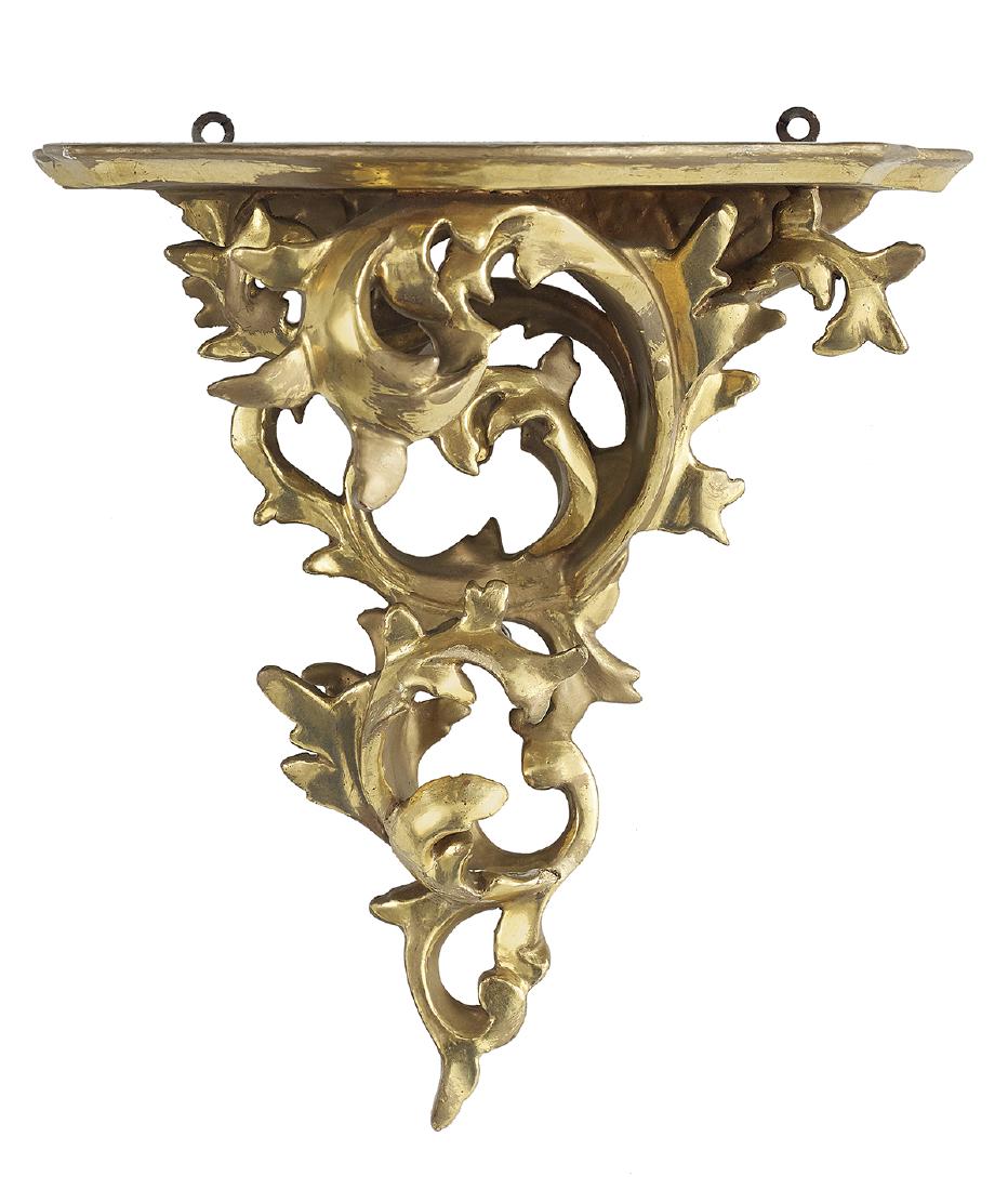 Florentine Giltwood Bracket Shelf: Florentine Giltwood Bracket Shelf 20th century, in the rococo taste, heavily carved and gilded. h. 10-1/2", w. 10-3/4", d. 6-1/4"