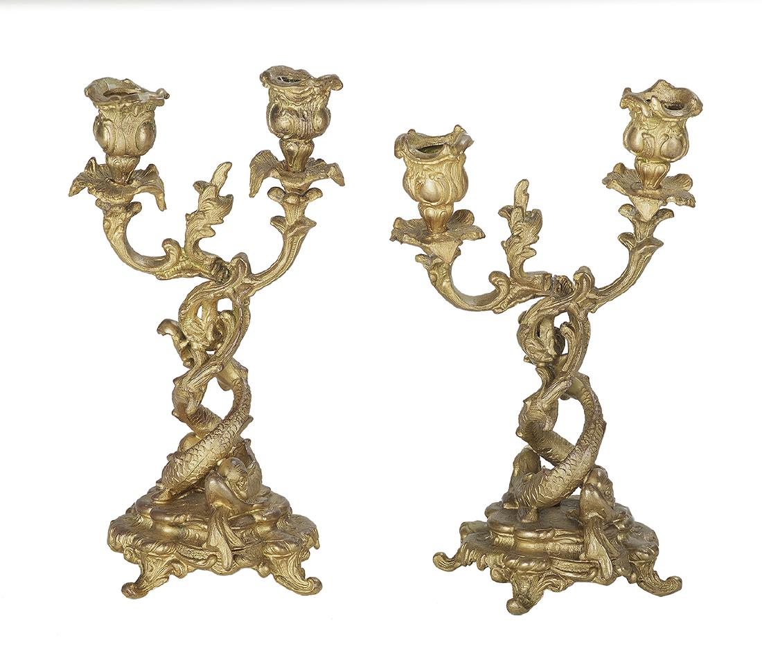 Pair of Rococo-Style Gilt-Metal Candlesticks: Pair of Rococo-Style Gilt-Metal Candlesticks ca. 1900, Continental, the standards molded with intertwined dolphins. h. 10", w. 5-1/2", d. 4-1/2"